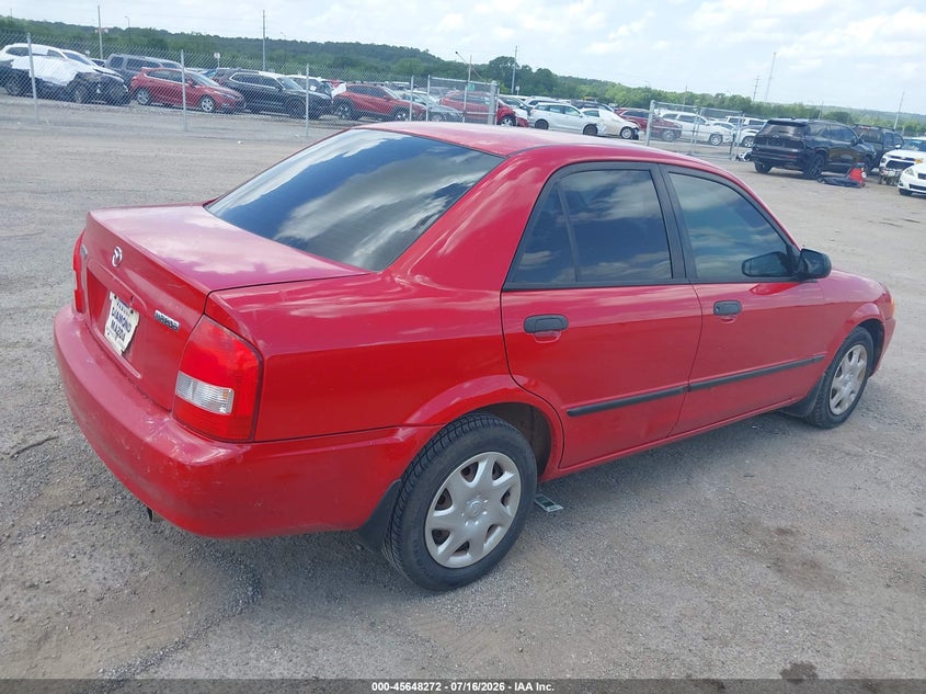 2000 Mazda Protege VIN JM1BJ2225Y0246487 IAAI salvage auction — NORMAL WEAR, Clear (Oklahoma), sold $25 on 2026-07-21 (photo 4)