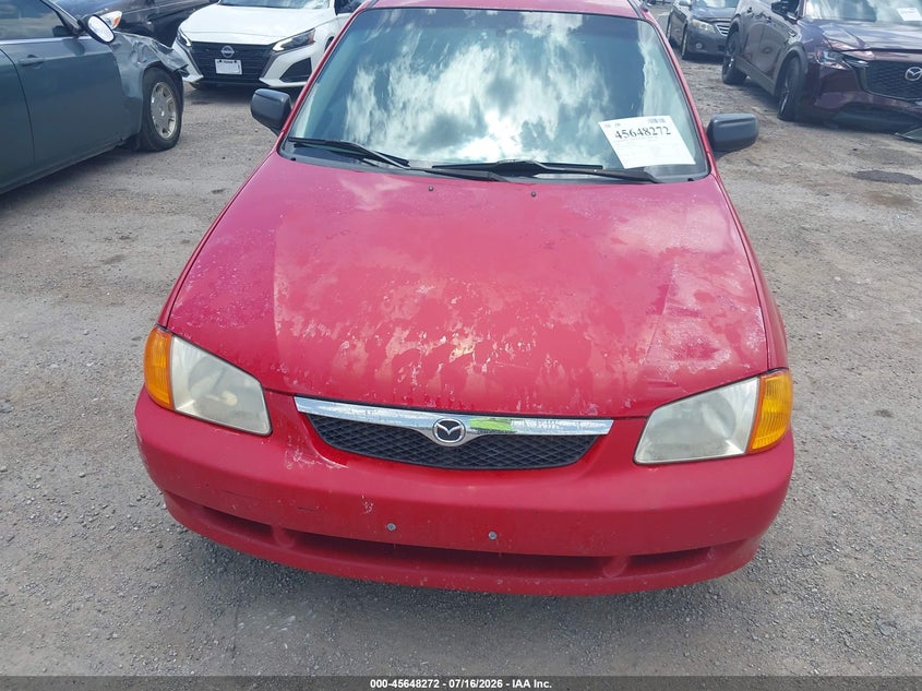 2000 Mazda Protege VIN JM1BJ2225Y0246487 IAAI salvage auction — NORMAL WEAR, Clear (Oklahoma), sold $25 on 2026-07-21 (photo 6)