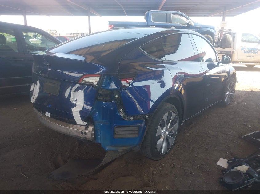 2023 Tesla Model y VIN 7SAYGAEE7PF897471 IAAI salvage auction — UNKNOWN, Salvage (Arizona), sold $10,100 on 2026-07-31 (photo 4)