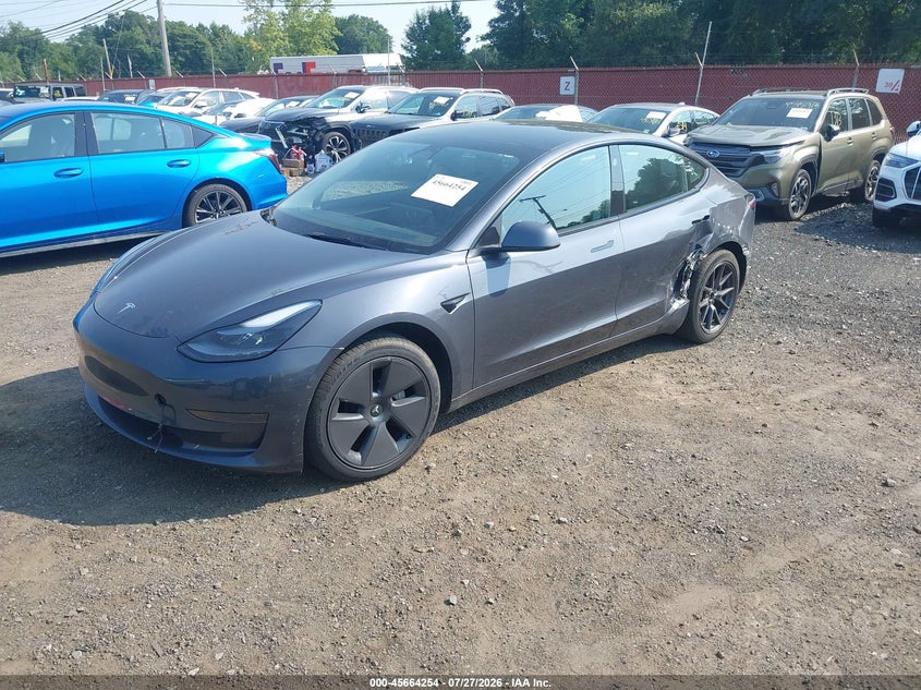 2023 Tesla Model 3 VIN 5YJ3E1EA2PF701799 IAAI salvage auction — LEFT SIDE, Wait Title, sold $9,750 on 2026-09-09 (photo 2)