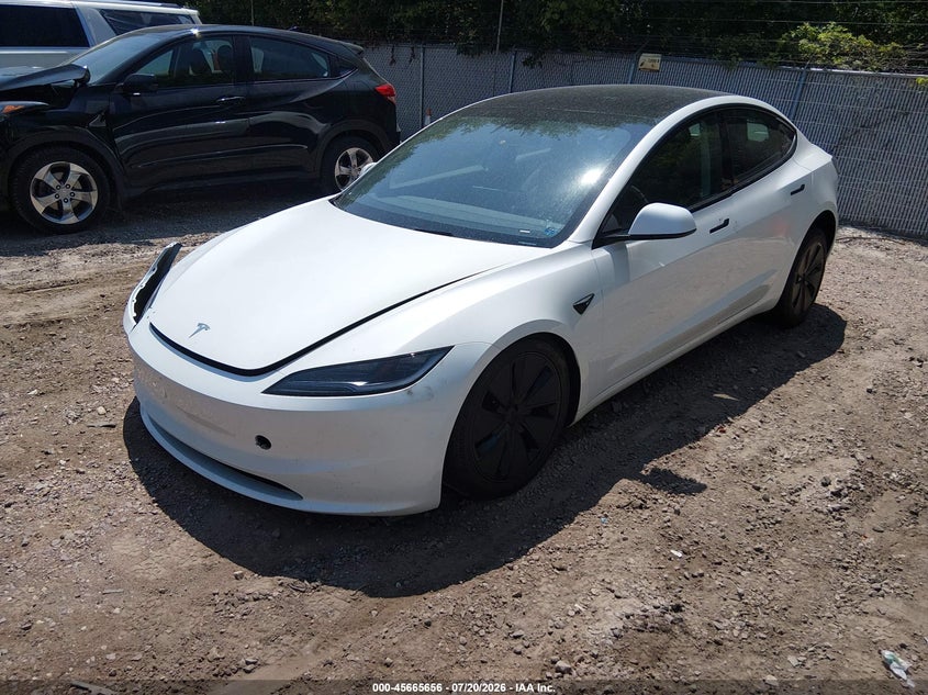 2025 Tesla Model 3 VIN 5YJ3E1EB8SF911955 IAAI salvage auction — RIGHT FRONT, Salvage (Wisconsin), sold $14,000 on 2026-08-02 (photo 2)