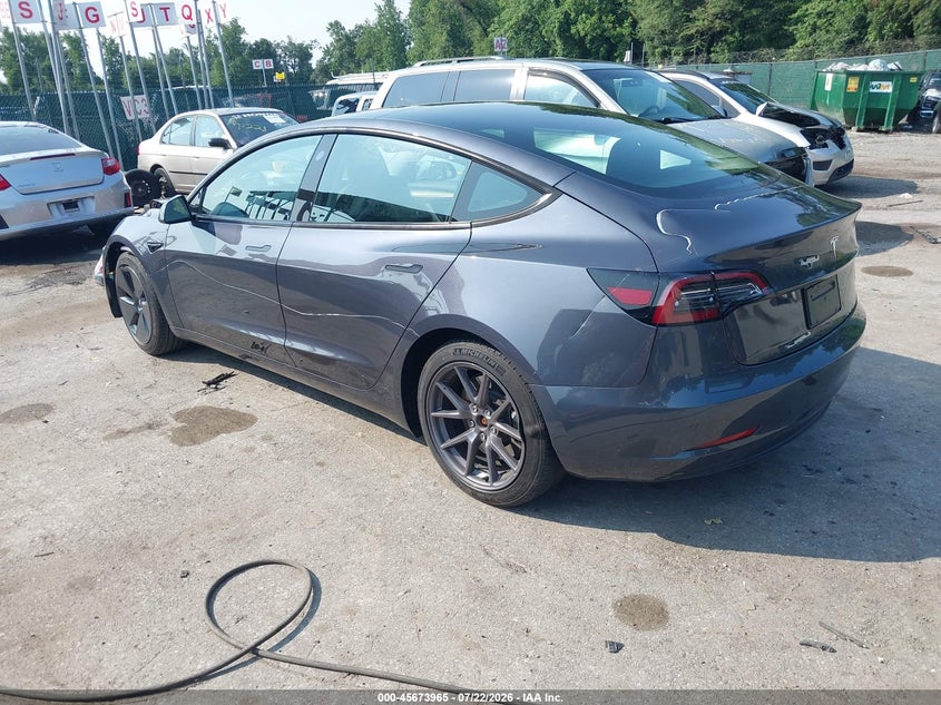 2023 Tesla Model 3 VIN 5YJ3E1EA7PF668542 IAAI salvage auction — FRONT & REAR, Wait Title, sold $6,600 on 2026-08-01 (photo 3)