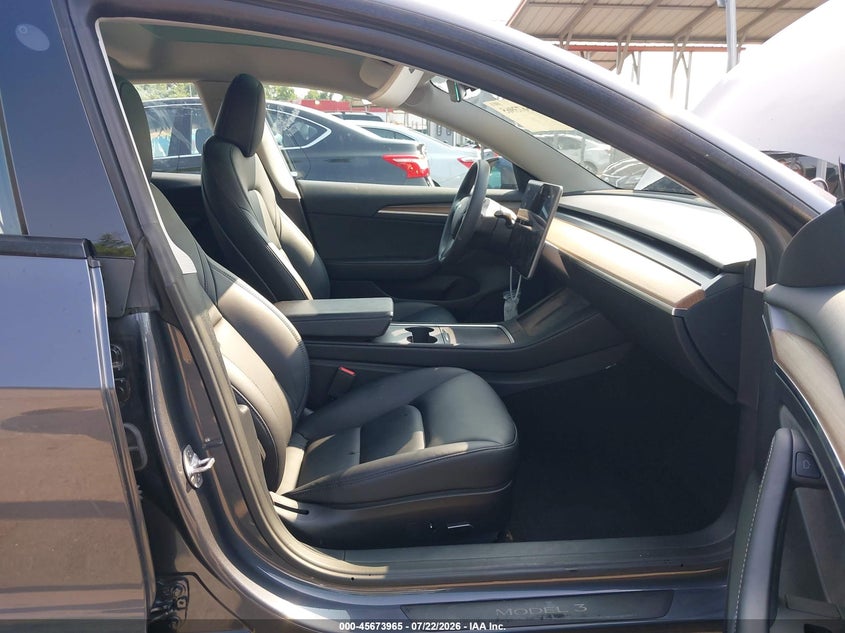 2023 Tesla Model 3 VIN 5YJ3E1EA7PF668542 IAAI salvage auction — FRONT & REAR, Wait Title, sold $6,600 on 2026-08-01 (photo 5)
