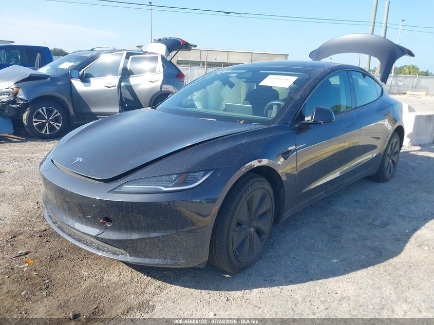 2025 Tesla Model 3 VIN 5YJ3E1EAXSF018886 IAAI salvage auction — SIDE, Wait Title, sold $13,900 on 2026-09-01 (photo 2)