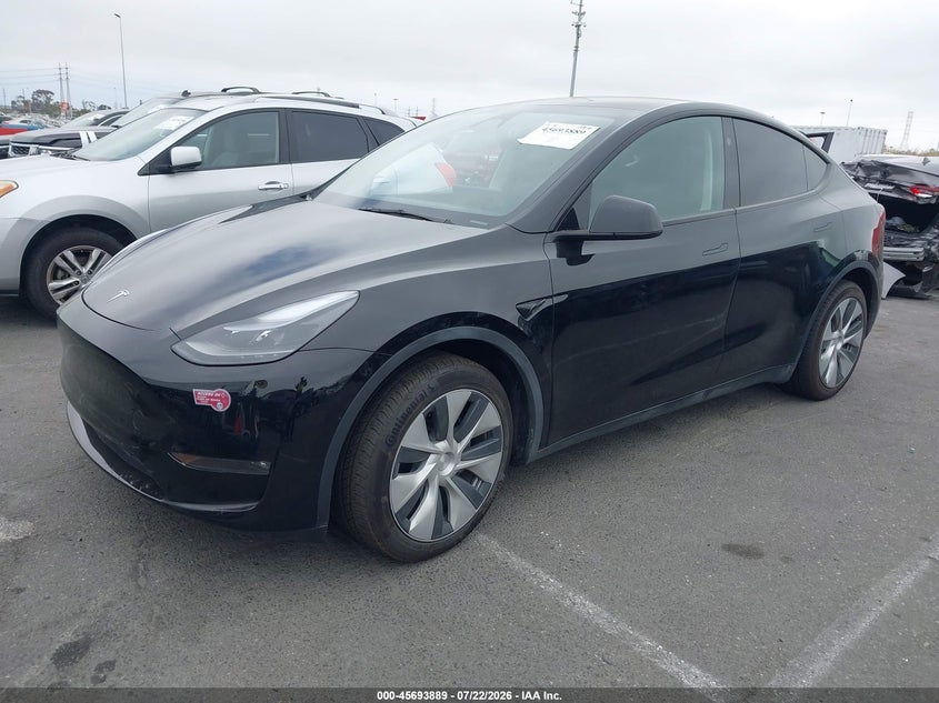2024 Tesla Model y VIN 7SAYGAEE8RF983066 IAAI salvage auction — SIDE, Salvage Title, sold $16,100 on 2026-08-02 (photo 2)