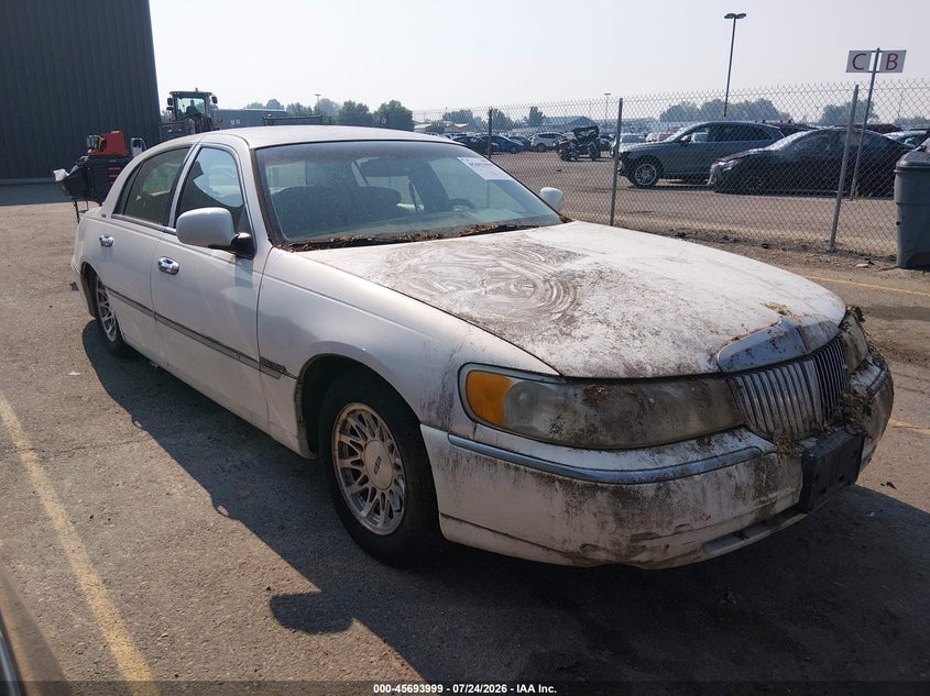 1998 Lincoln TOWN CAR VIN 1LNFM82W3WY676298 IAAI salvage auction — NORMAL WEAR, Clear (Idaho), sold $150 on 2026-07-31 (photo 1)