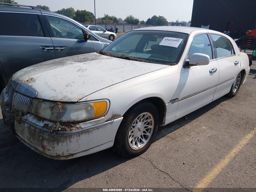 1998 Lincoln TOWN CAR VIN 1LNFM82W3WY676298 IAAI salvage auction — NORMAL WEAR, Clear (Idaho), sold $150 on 2026-07-31 (photo 2)