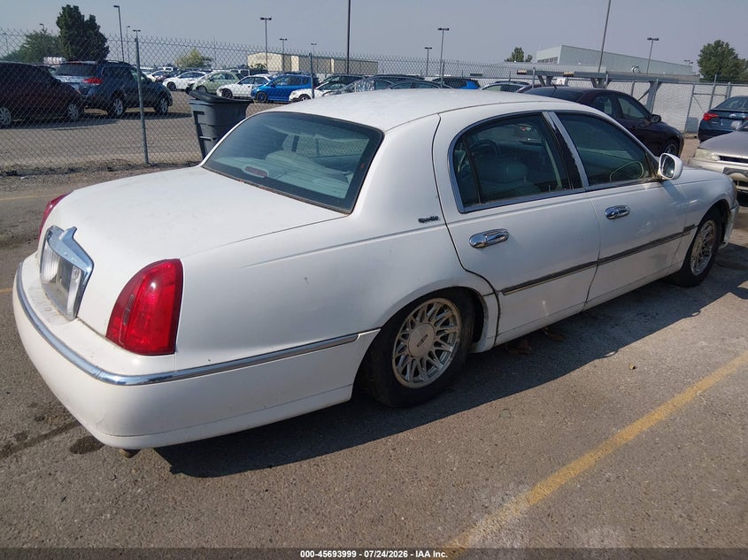 1998 Lincoln TOWN CAR VIN 1LNFM82W3WY676298 IAAI salvage auction — NORMAL WEAR, Clear (Idaho), sold $150 on 2026-07-31 (photo 4)