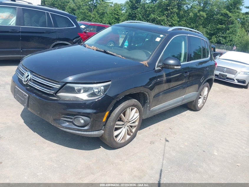 2014 Volkswagen Tiguan VIN WVGBV3AX4EW562121 IAAI salvage auction — NORMAL WEAR, Wait Title, sold $425 on 2026-08-07 (photo 2)