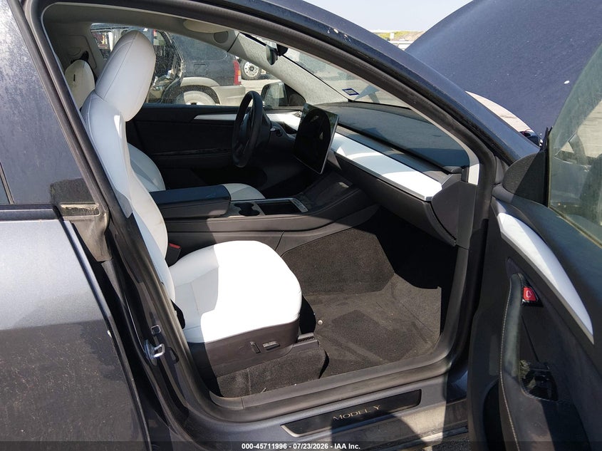 2023 Tesla Model y VIN 7SAYGAEE5PF584659 IAAI salvage auction — ALL OVER, Salvage Title, sold $10,100 on 2026-09-02 (photo 5)