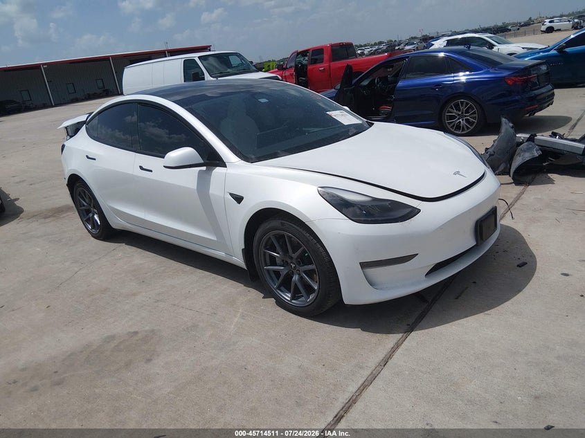 2023 Tesla Model 3 VIN 5YJ3E1EA7PF590067 IAAI salvage auction — REAR END, Salvage Title, sold $9,975 on 2026-09-19 (photo 1)