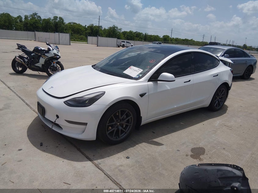 2023 Tesla Model 3 VIN 5YJ3E1EA7PF590067 IAAI salvage auction — REAR END, Salvage Title, sold $9,975 on 2026-09-19 (photo 2)