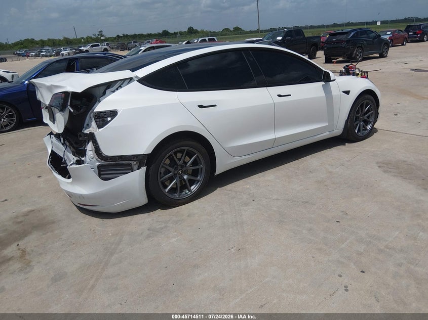 2023 Tesla Model 3 VIN 5YJ3E1EA7PF590067 IAAI salvage auction — REAR END, Salvage Title, sold $9,975 on 2026-09-19 (photo 4)