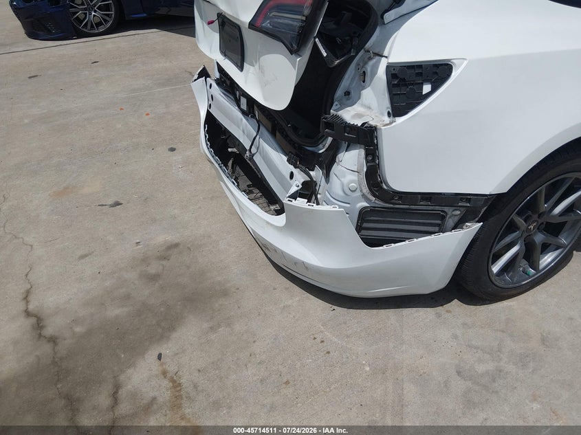 2023 Tesla Model 3 VIN 5YJ3E1EA7PF590067 IAAI salvage auction — REAR END, Salvage Title, sold $9,975 on 2026-09-19 (photo 6)