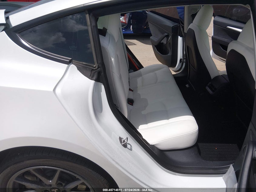 2023 Tesla Model 3 VIN 5YJ3E1EA7PF590067 IAAI salvage auction — REAR END, Salvage Title, sold $9,975 on 2026-09-19 (photo 8)