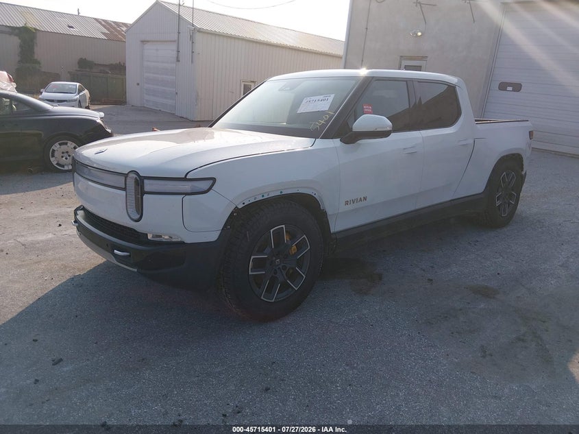 2023 Rivian R1t VIN 7FCTGAAAXPN022973 IAAI salvage auction — SIDE, Wait Title, sold $23,525 on 2026-09-14 (photo 2)