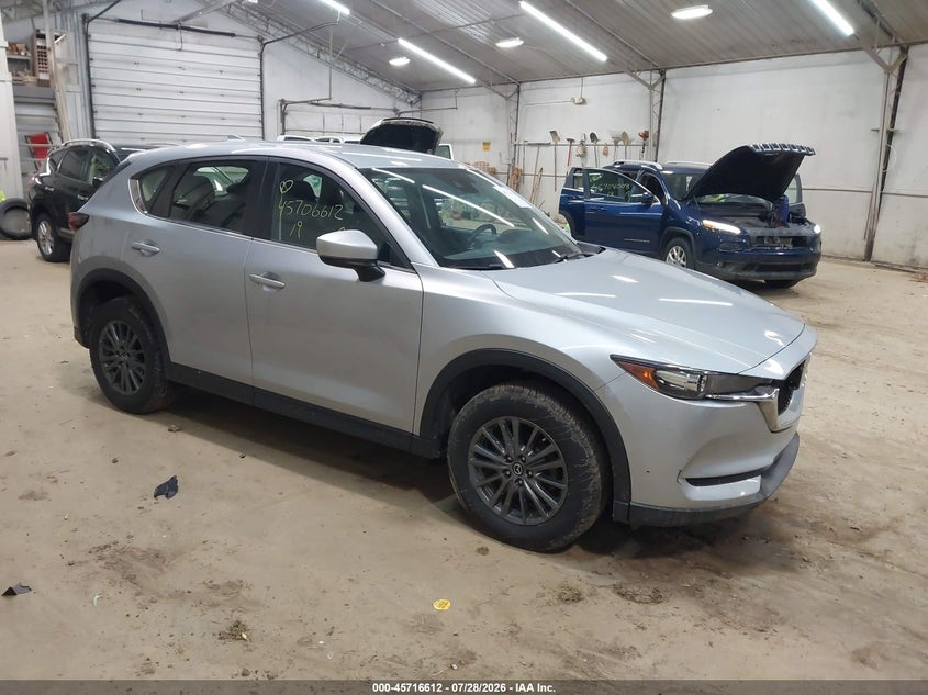 2019 Mazda Cx-5 VIN JM3KFBBM4K1635830 IAAI salvage auction — SIDE, Wait Title, sold $5,200 on 2026-09-10 (photo 1)