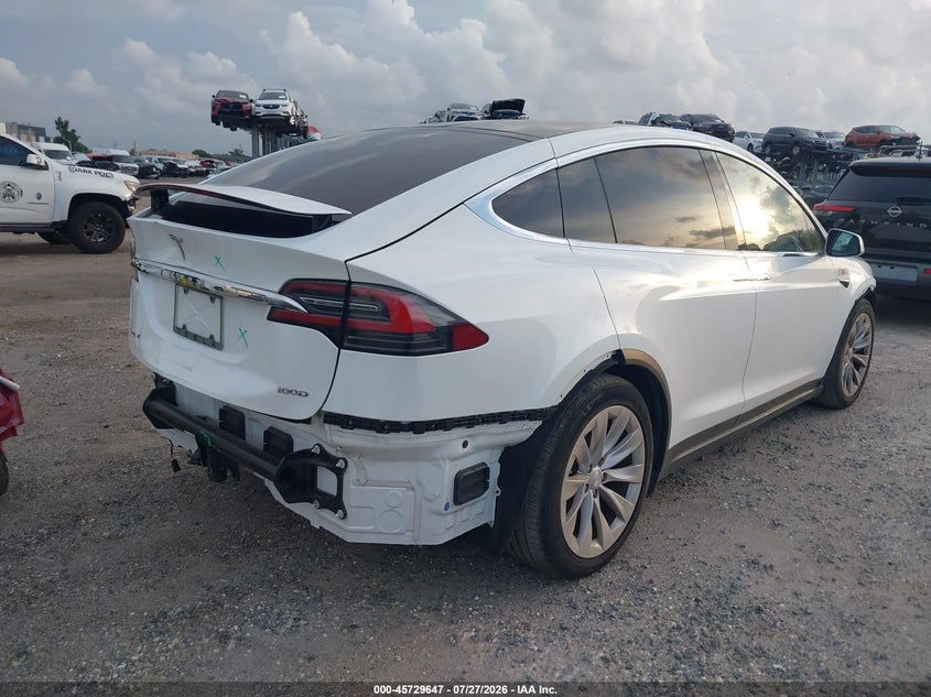 2017 Tesla Model x VIN 5YJXCDE28HF068325 IAAI salvage auction — FRONT & REAR, Rebuildable (Florida), sold $8,550 on 2026-08-20 (photo 4)