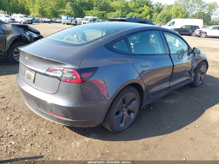 2023 Tesla Model 3 VIN 5YJ3E1EA3PF638731 IAAI salvage auction — RIGHT SIDE, Salvage (Idaho), sold $10,725 on 2026-09-08 (photo 4)