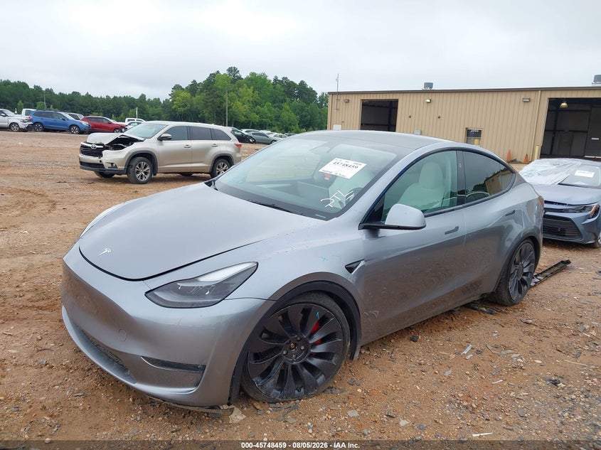 2024 Tesla Model y VIN 7SAYGDEFXRA303594 IAAI salvage auction — SIDE, Salvage (North Carolina), sold $16,500 on 2026-08-30 (photo 2)