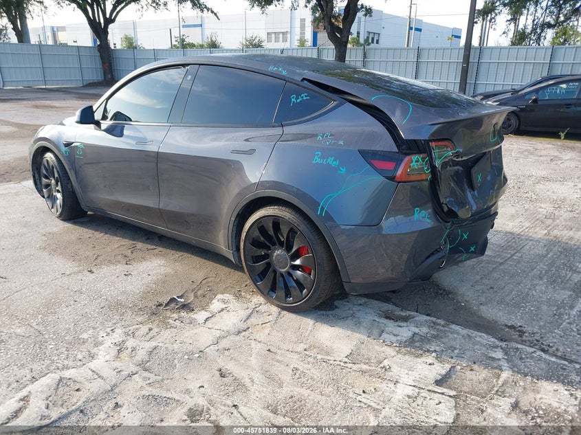 2022 Tesla Model y VIN 7SAYGDEF3NF404313 IAAI salvage auction — REAR END, Rebuildable (Florida), sold $7,600 on 2026-08-30 (photo 3)
