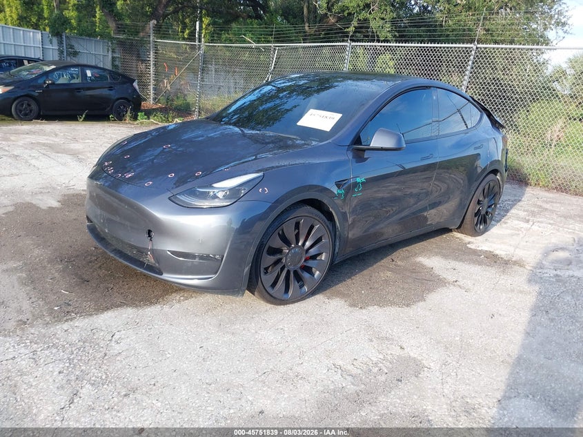 2022 Tesla Model y VIN 7SAYGDEF3NF404313 IAAI salvage auction — REAR END, Rebuildable (Florida), sold $7,600 on 2026-08-30 (photo 2)