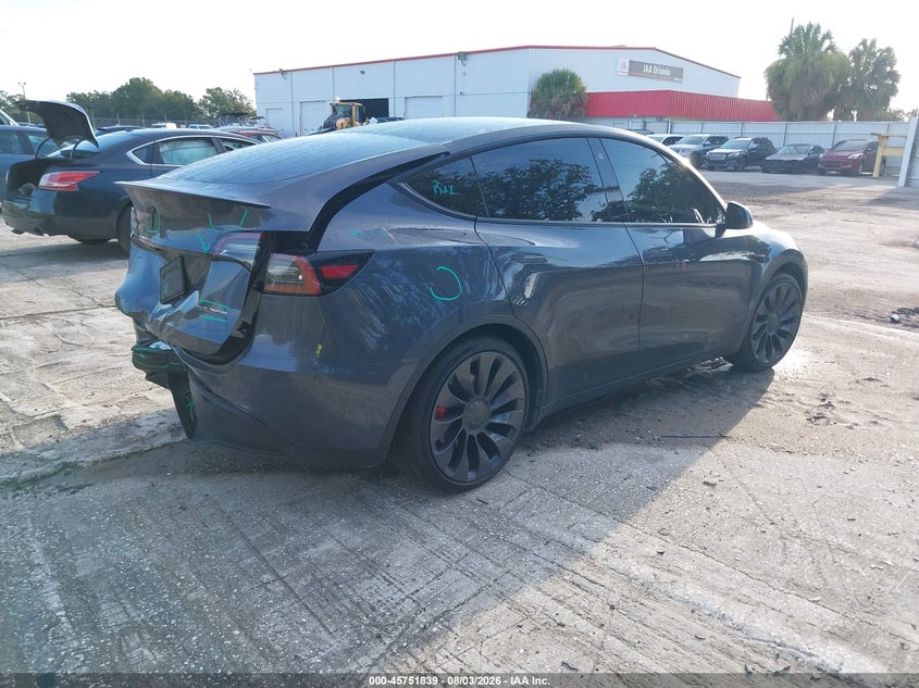 2022 Tesla Model y VIN 7SAYGDEF3NF404313 IAAI salvage auction — REAR END, Rebuildable (Florida), sold $7,600 on 2026-08-30 (photo 4)