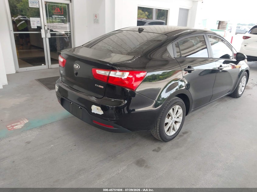 2014 Kia Rio VIN KNADN4A34E6349022 IAAI salvage auction — NORMAL WEAR, Clear (Florida), sold $700 on 2026-08-02 (photo 4)