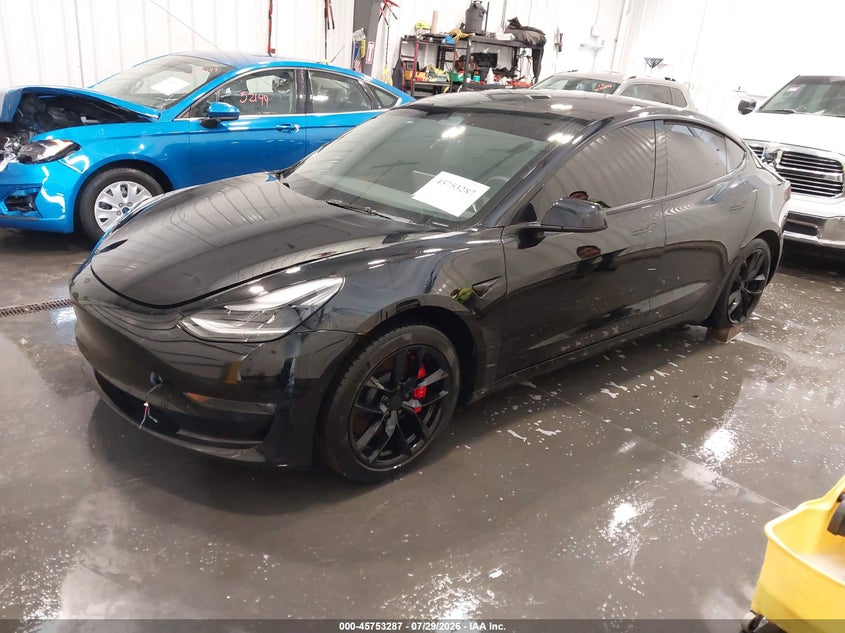 2022 Tesla Model 3 VIN 5YJ3E1EC3NF331803 IAAI salvage auction — LEFT REAR, Salvage (Nebraska), sold $10,900 on 2026-08-24 (photo 2)