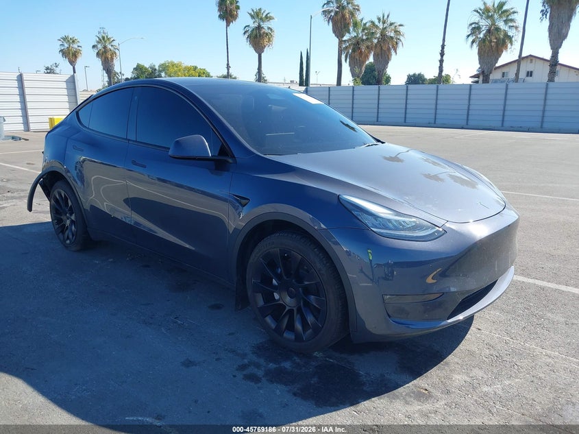 2023 Tesla Model y VIN 7SAYGDEE4PA113410 — IAAI salvage auction photo