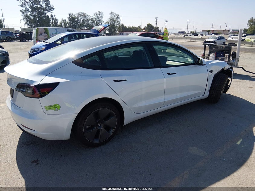 2023 Tesla Model 3 VIN 5YJ3E1EA0PF568203 IAAI salvage auction — RIGHT FRONT, Salvage (California), sold $6,500 on 2026-09-09 (photo 4)