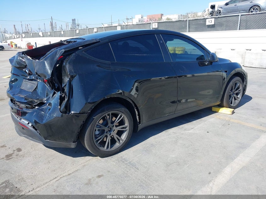 2025 Tesla Model y VIN 7SAYGDED7SF231017 IAAI salvage auction — REAR END, Wait Title, sold $10,800 on 2026-09-17 (photo 4)