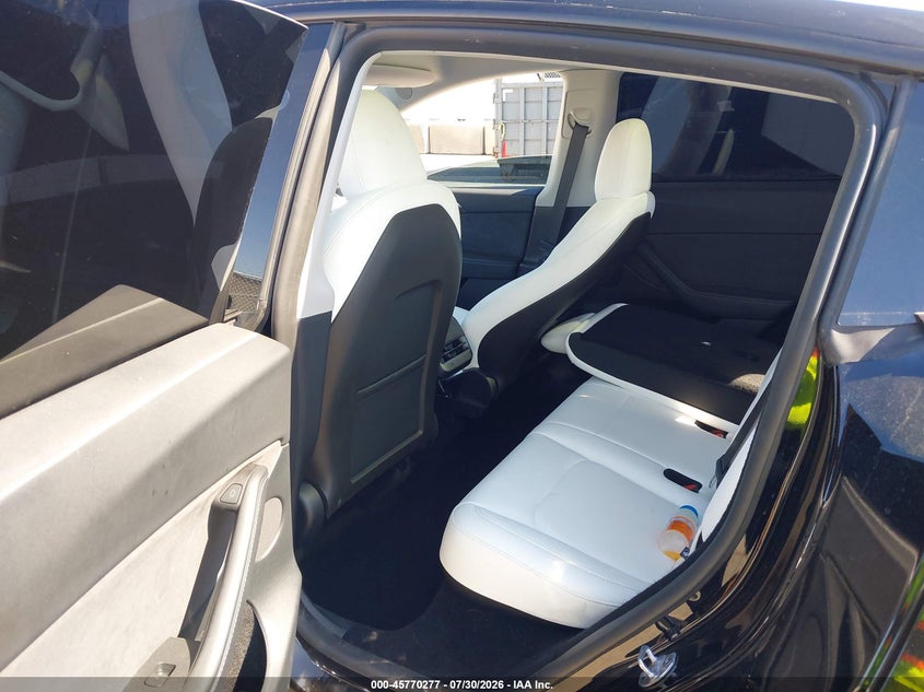 2025 Tesla Model y VIN 7SAYGDED7SF231017 IAAI salvage auction — REAR END, Wait Title, sold $10,800 on 2026-09-17 (photo 8)