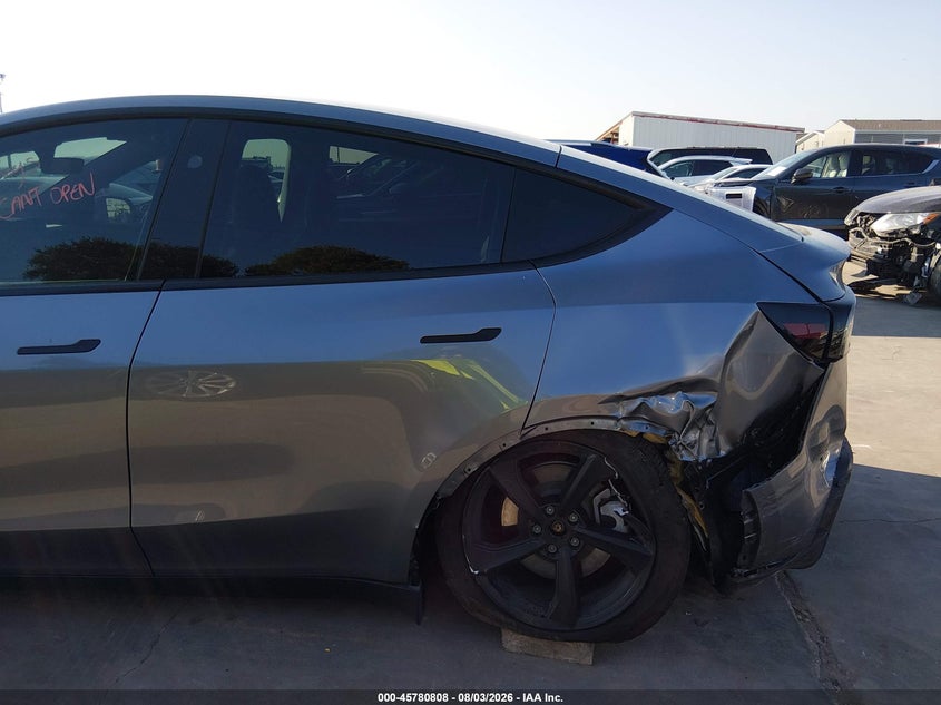 2026 Tesla Model y VIN 7SAYGDED0TA452151 IAAI salvage auction — LEFT REAR, Original (Texas), sold $23,950 on 2026-09-15 (photo 6)