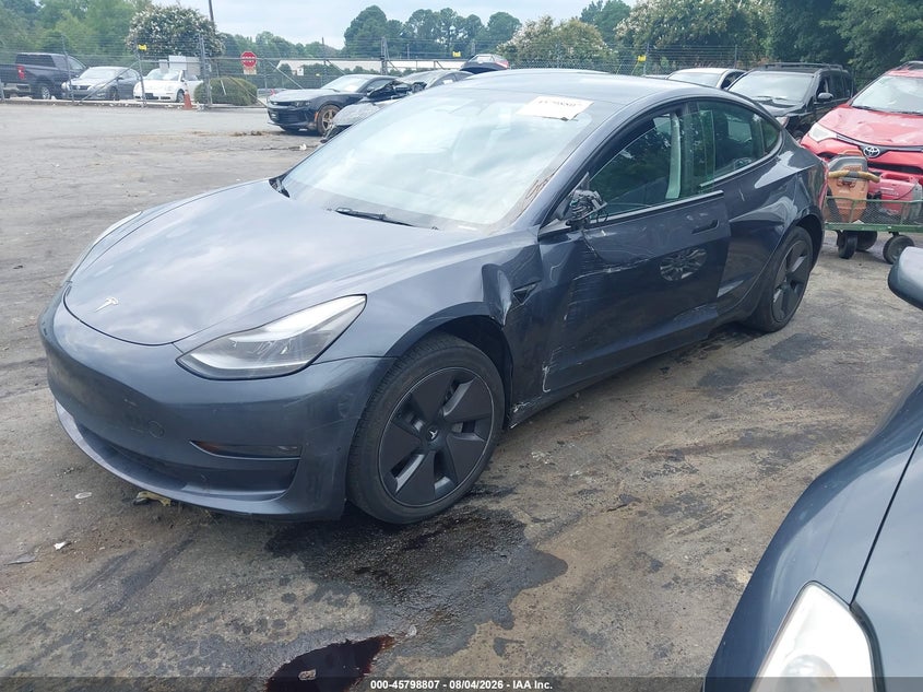 2023 Tesla Model 3 VIN 5YJ3E1EA6PF612995 IAAI salvage auction — SIDE, Salvage Title, sold $10,000 on 2026-08-23 (photo 2)