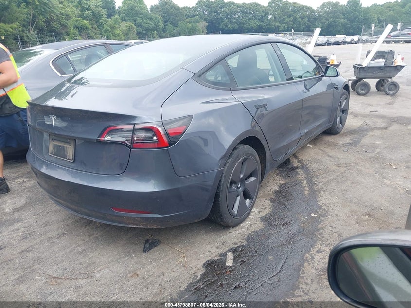 2023 Tesla Model 3 VIN 5YJ3E1EA6PF612995 IAAI salvage auction — SIDE, Salvage Title, sold $10,000 on 2026-08-23 (photo 4)