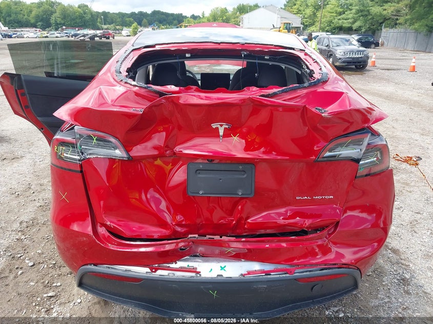 2023 Tesla Model y VIN 7SAYGDEE2PA030333 IAAI salvage auction — REAR END, Salvage Title, sold $12,300 on 2026-10-10 (photo 6)