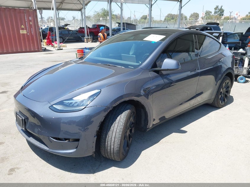 2023 Tesla Model y VIN 7SAYGDEE3PA137620 IAAI salvage auction — RIGHT FRONT, Salvage Title, sold $12,600 on 2026-08-21 (photo 2)