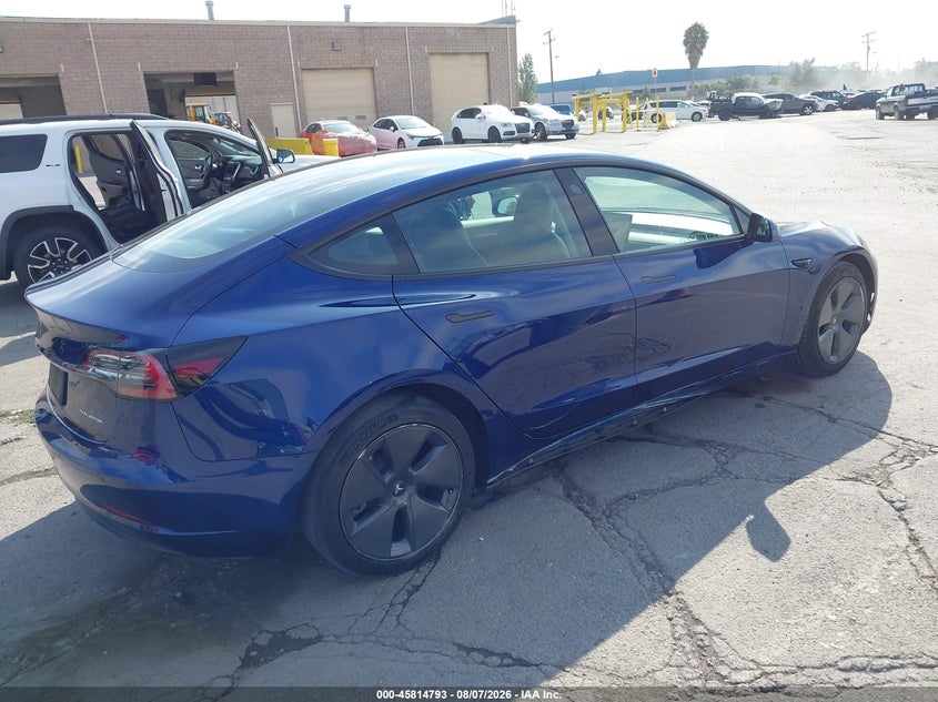 2022 Tesla Model 3 VIN 5YJ3E1EB8NF317533 IAAI salvage auction — LEFT SIDE, Salvage Title, sold $9,400 on 2026-10-08 (photo 4)