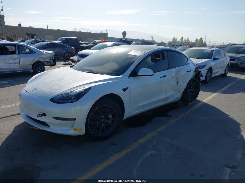 2022 Tesla Model 3 VIN 5YJ3E1EAXNF147974 IAAI salvage auction — SIDE, Salvage (California), sold $4,250 on 2026-08-30 (photo 2)