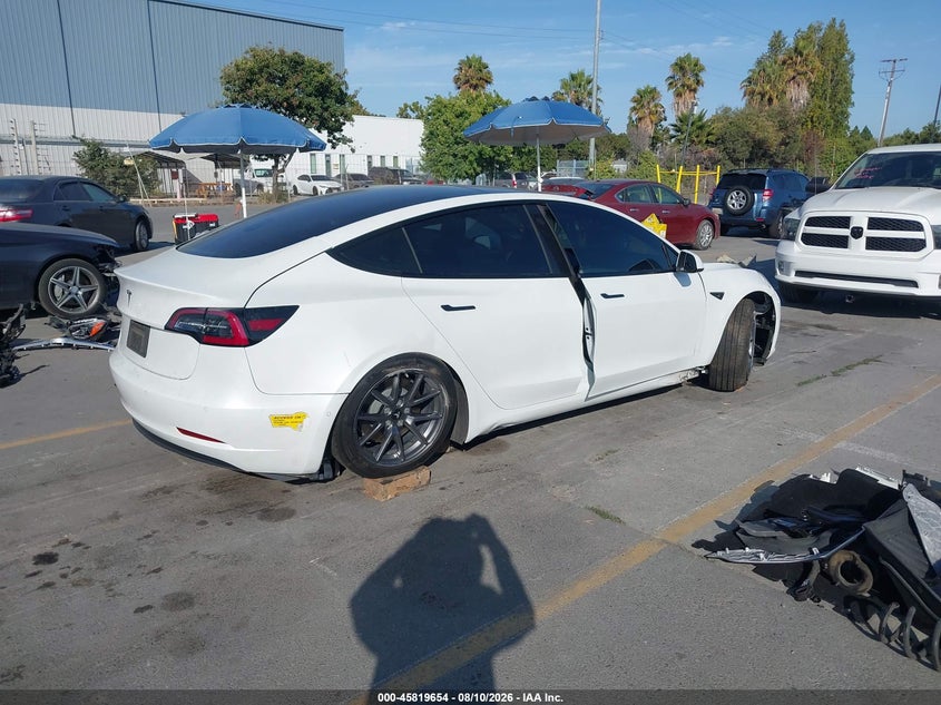 2022 Tesla Model 3 VIN 5YJ3E1EAXNF147974 IAAI salvage auction — SIDE, Salvage (California), sold $4,250 on 2026-08-30 (photo 4)