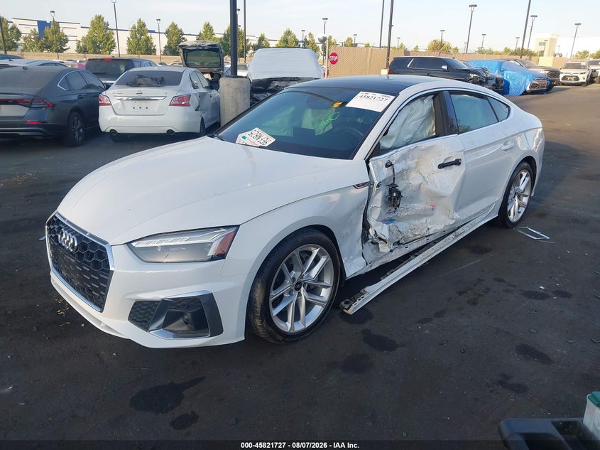 2023 Audi A5 VIN WAUFACF53PA021941 IAAI salvage auction — SIDE, Wait Title, sold $9,800 on 2026-10-23 (photo 2)