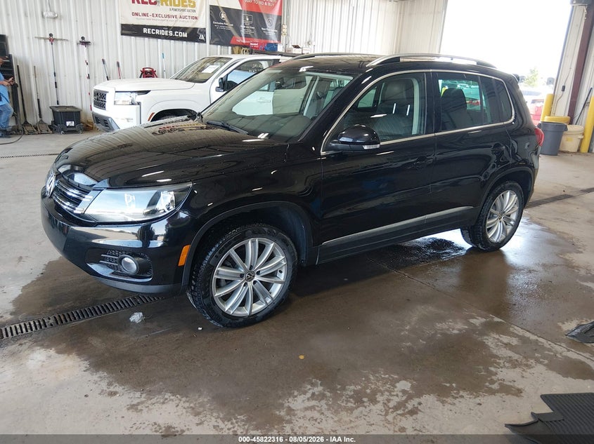 2014 Volkswagen Tiguan VIN WVGBV3AX2EW568984 IAAI salvage auction — LEFT SIDE, Previously Damaged (North Dakota), sold $1,050 on 2026-08-13 (photo 2)