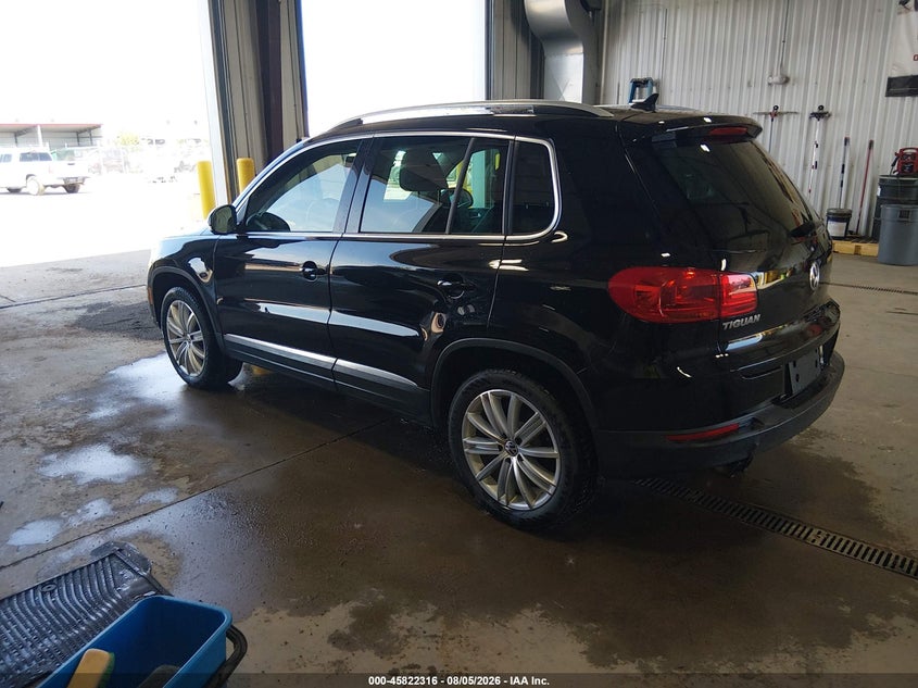 2014 Volkswagen Tiguan VIN WVGBV3AX2EW568984 IAAI salvage auction — LEFT SIDE, Previously Damaged (North Dakota), sold $1,050 on 2026-08-13 (photo 3)