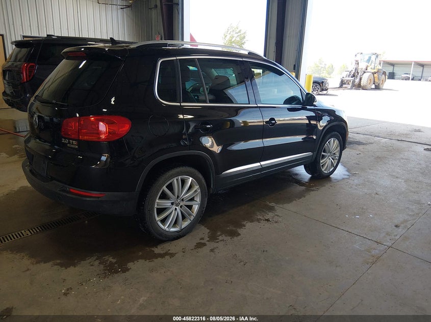 2014 Volkswagen Tiguan VIN WVGBV3AX2EW568984 IAAI salvage auction — LEFT SIDE, Previously Damaged (North Dakota), sold $1,050 on 2026-08-13 (photo 4)