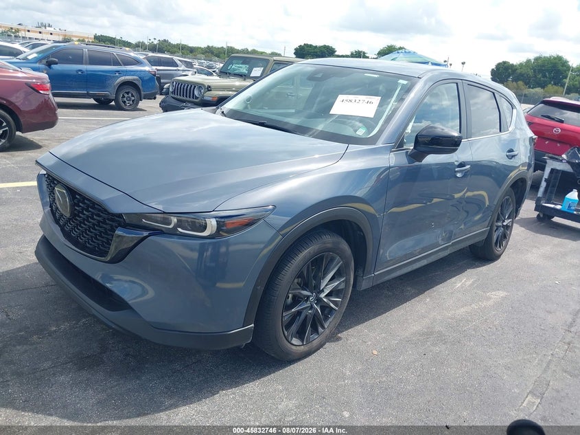 2023 Mazda Cx-5 VIN JM3KFBCM5P0205008 IAAI salvage auction — SIDE, Salvage Title, sold $7,600 on 2026-09-02 (photo 2)