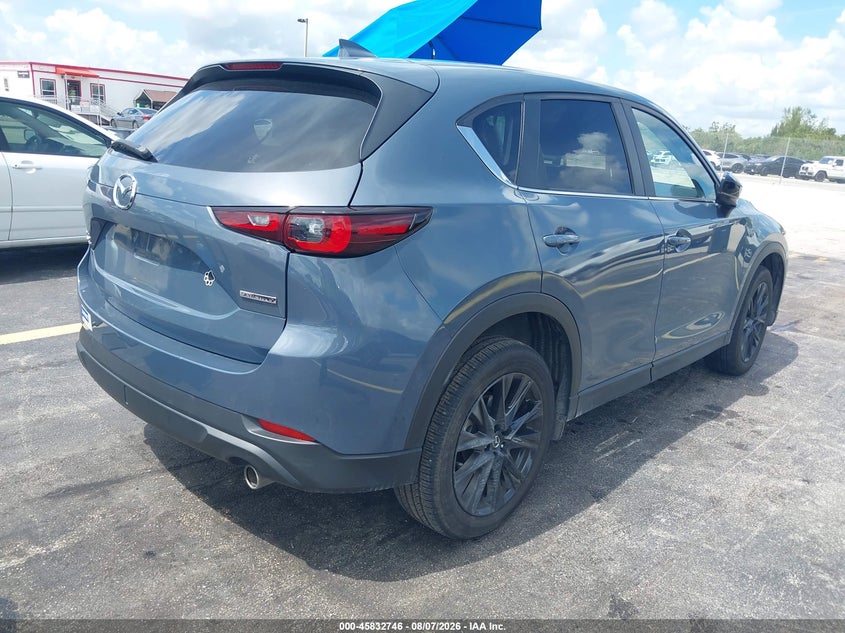 2023 Mazda Cx-5 VIN JM3KFBCM5P0205008 IAAI salvage auction — SIDE, Salvage Title, sold $7,600 on 2026-09-02 (photo 4)