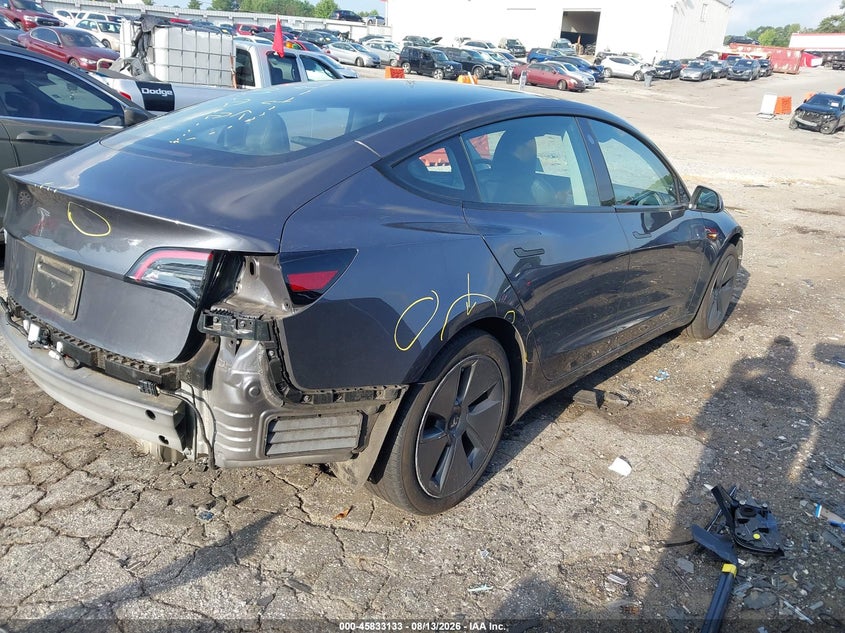 2023 Tesla Model 3 VIN 5YJ3E1EA0PF699003 IAAI salvage auction — REAR END, Salvage Title, sold $6,600 on 2026-08-30 (photo 4)