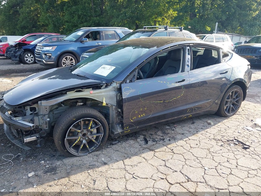 2023 Tesla Model 3 VIN 5YJ3E1EA0PF699003 IAAI salvage auction — REAR END, Salvage Title, sold $6,600 on 2026-08-30 (photo 6)