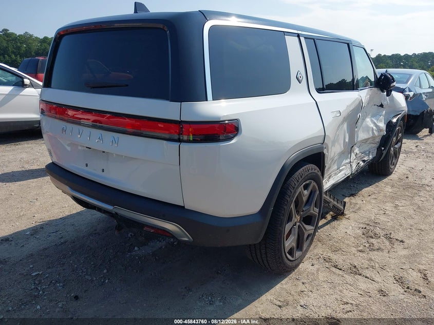 2023 Rivian R1s VIN 7PDSGABA9PN010385 IAAI salvage auction — SIDE, Wait Title, sold $18,000 on 2026-10-01 (photo 4)